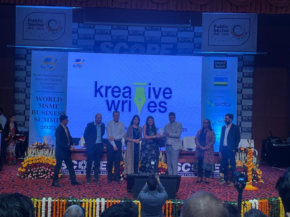 Kreative Writes receiving its award on stage at the World MSME Business Summit 2023